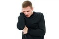 a man in black clothes holds on head on a white background.a headache or earache