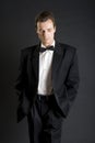 Man in black dinner jacket with bow tie