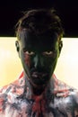 Man with black face and sullen look