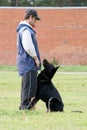 Man and Black German shepherd