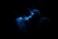 Man in black hood in the night darkness, dimly lit, concepts of Royalty Free Stock Photo