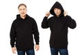 Man in black hoodie hoody set front view, hoody mockup isolated on white background. Man puts on a hood Royalty Free Stock Photo
