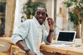 Man black male young person sitting working business laptop portrait african happy adult computer Royalty Free Stock Photo