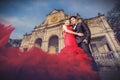 Man in black suit and Beautiful woman wearing fashionable red dress Royalty Free Stock Photo