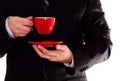 Man in black suit hold coffee cup