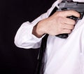 Man in black suit holding gun in hand. Secret agent, mafia, bodyguard concept Royalty Free Stock Photo