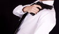 Man in black suit holding gun in hand. Secret agent, mafia, bodyguard concept Royalty Free Stock Photo