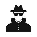 Man in black sunglasses and black hat