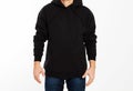 Man in black sweatshirt on white background - male hoodie mock up, black hood blank