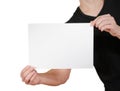 Man in black t shirt holding blank white A4 paper. Leaflet presentation. Pamphlet hold hands. Man show clear offset paper. Sheet Royalty Free Stock Photo