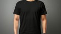 Man in black t shirt mockup template on light gray wall background for design print studio