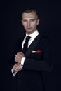 Man in a black tuxedo suit and white shirt Royalty Free Stock Photo