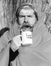 Man in blanket with cup Royalty Free Stock Photo