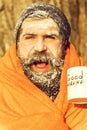 Man in blanket with cup Royalty Free Stock Photo