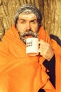 Man in blanket with cup Royalty Free Stock Photo