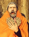 Man in blanket with heart on natural background Royalty Free Stock Photo