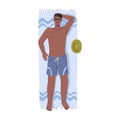 Man on blanket by seaside, sunbathing guy on beach Royalty Free Stock Photo