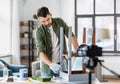 man or blogger repainting old table at home