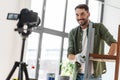 man or blogger repainting old table at home