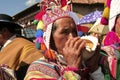 Man blowing a conch shell at Paucartambo`s Festival of Virgen del Carmen.