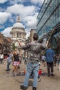 Man blows bubbles for children at St Pauls Cathedral