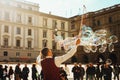 Man blows bubbles in Italy