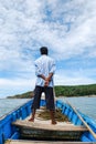 Man in a blue boat