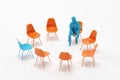 A man in blue color looking at outstanding blue chair among orange chairs