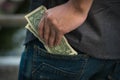 Man keep Us dollars money in jeans pocket Royalty Free Stock Photo