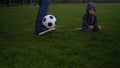 Man In Blue Jeans And Moccasins Juggling Black and White Classic Soccer Ball. People Go In For Sports. Young Boy Playing Royalty Free Stock Photo