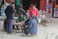 Men in blue Mao suits gamble with cards, Daxu, China