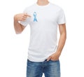 Man with blue prostate cancer awareness ribbon