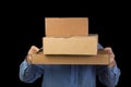 Man in blue shirt holds three cardboard boxes. covers her face Royalty Free Stock Photo