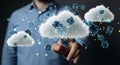 A man in a blue shirt interacting with cloud computing technology Royalty Free Stock Photo