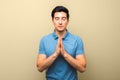 Man in blue shirt praying with eyes closed. hope for a better America and kind police Royalty Free Stock Photo