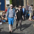 The man in blue shorts and woman in black are on Columbia Road