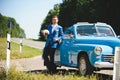 Man in Blue Suit at Blue Cabriolet Royalty Free Stock Photo