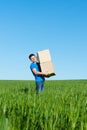 Man in blue t-shirt carrying boxes Royalty Free Stock Photo