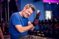 Man feeling strong pain in arm while training in the gym. People, fitness and healthcare concept Royalty Free Stock Photo