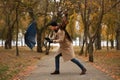 Man with blue umbrella caught in gust of wind outdoors Royalty Free Stock Photo