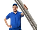 Man in blue uniform with flexible aluminum ducting tube in hand