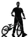 Man bmx acrobatic figure silhouette Royalty Free Stock Photo