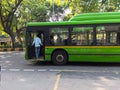 Man boarding a green DTC bus Royalty Free Stock Photo