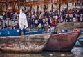 Man On Boat Near A Varanasi Ghat