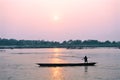 Man on boat at sunset, Chitwan Nepal Royalty Free Stock Photo