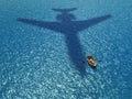 Man in a boat under a flying plane