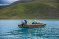 Man on a boat in Yamdrok lake