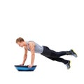 Man, body and push ups on bosu ball for fitness, exercise or workout on a white studio background. Young active male