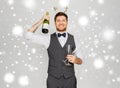 Man with bottle of champagne at christmas party Royalty Free Stock Photo