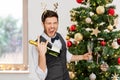 man with bottle of champagne at christmas party Royalty Free Stock Photo